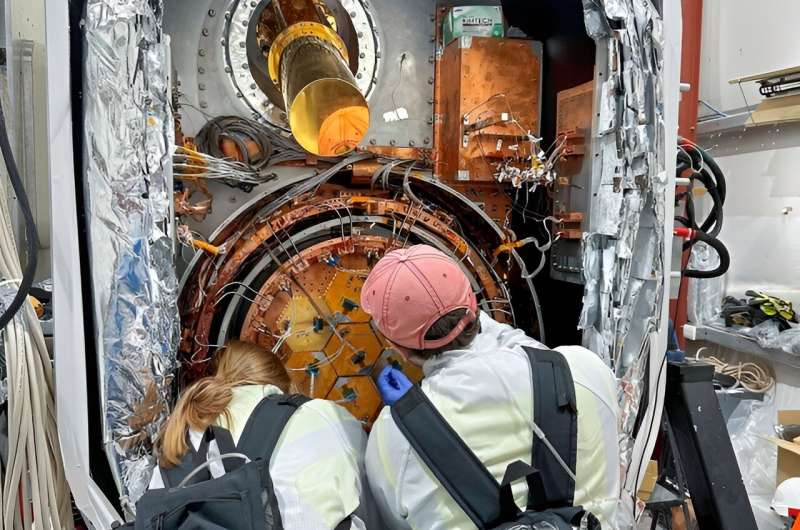 Doctoral candidate Ben Keller and Princeton collaborator Suzanne Staggs install a detector array into one of the Simons Oservatory small aperture telescopes last October. Credit: Yuhan Wang Simons Observatory begins measurements to probe Big Bang inflation